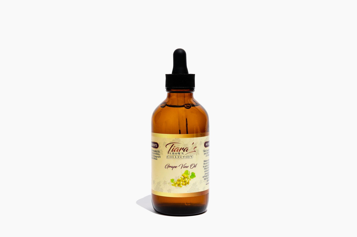 A bottle of Grapevine Oil with a dropper cap, labeled for hair and skin care.
